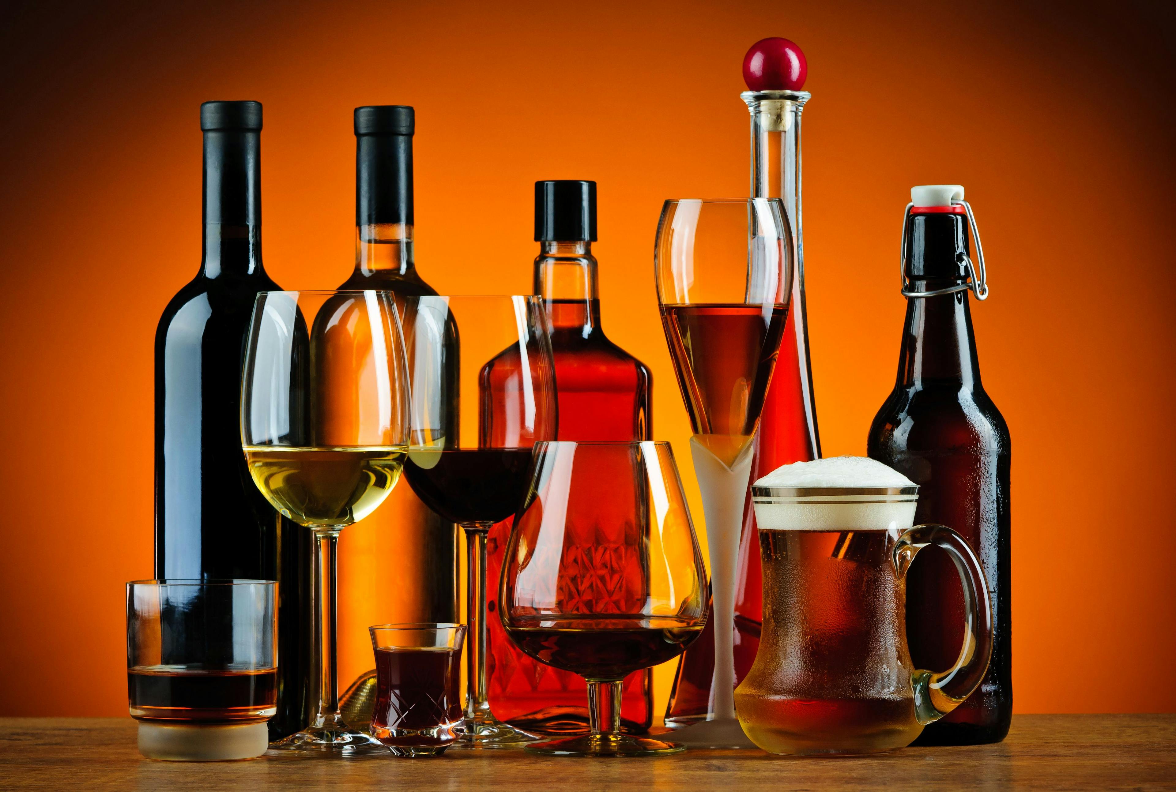 Bottles and glasses of alcohol drinks | Image Credit: © draghicich - stock.adobe.com.