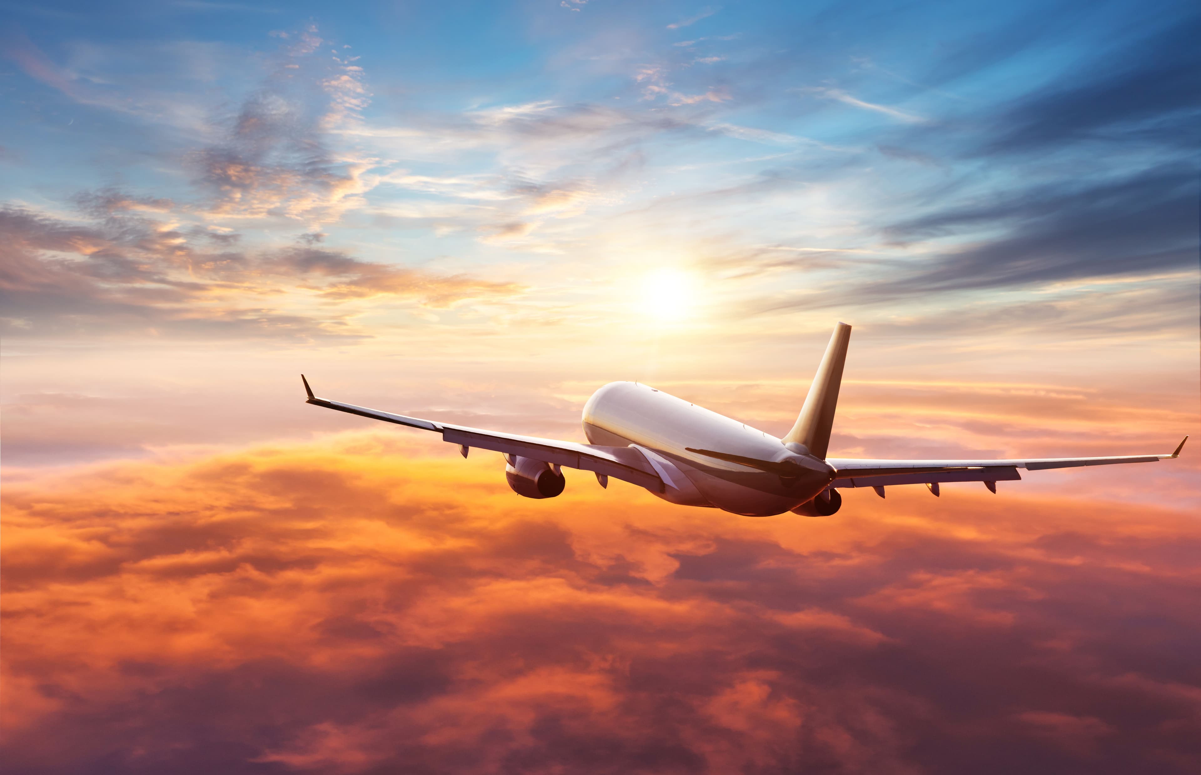 Passengers commercial airplane flying above clouds | Image Credit: © Jag_cz - stock.adobe.com