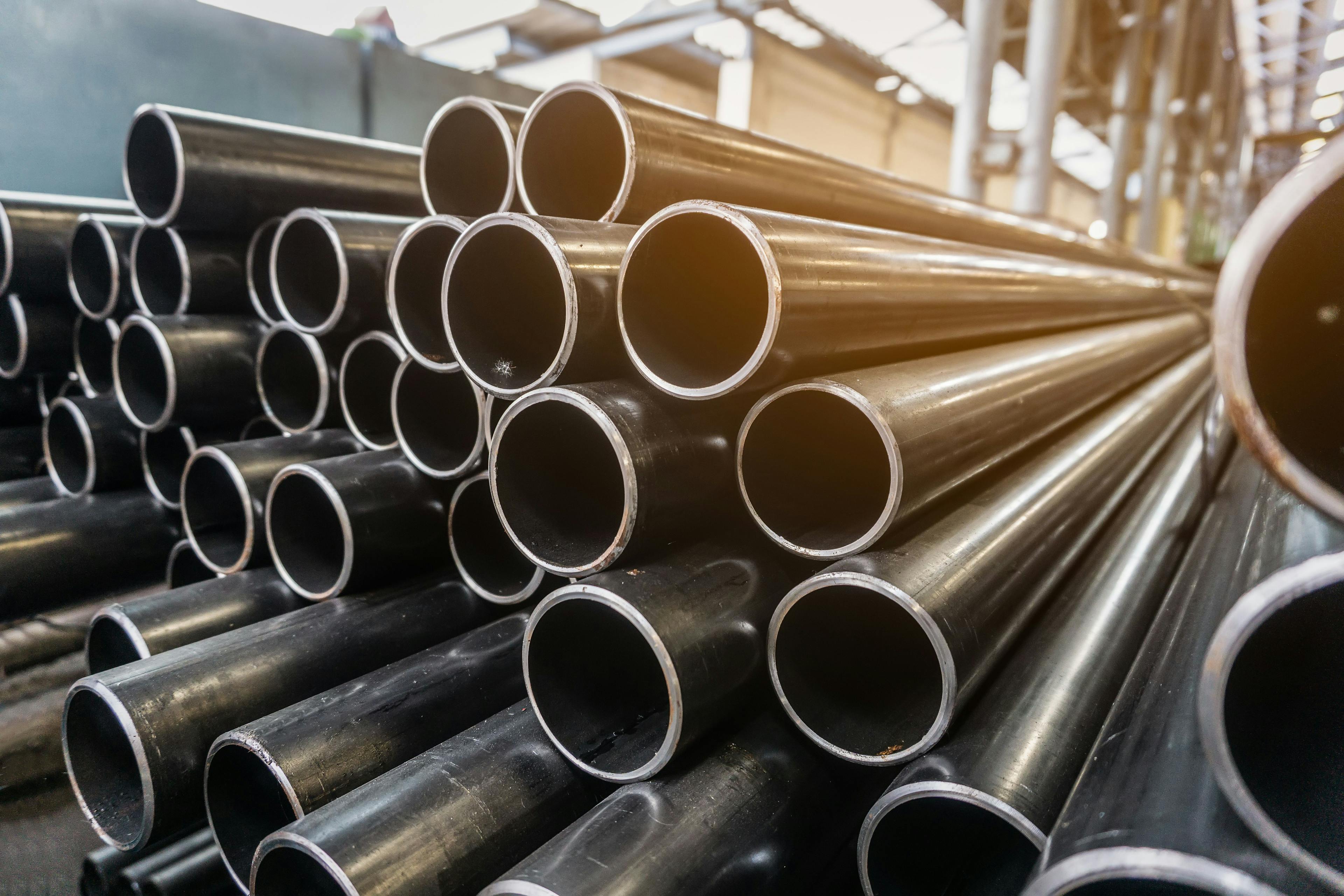 high quality Galvanized steel pipe or Aluminum and chrome stainless pipes in stack waiting for shipment in warehouse | Image Credit: © kasarp - stock.adobe.com.