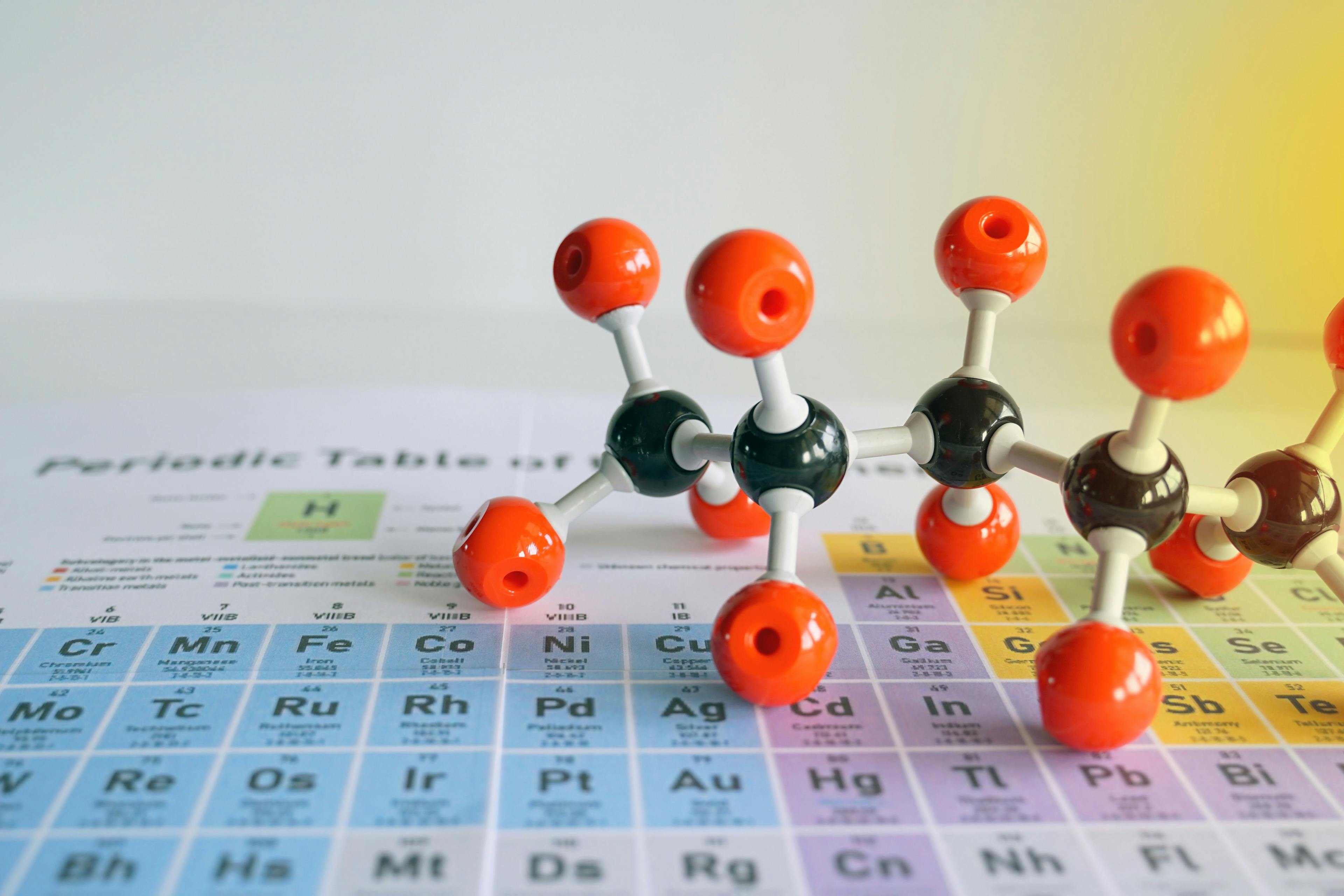 Simulate Shape of covalent molecules on a periodic table background. Soft and selective focus. | Image Credit: © Aoy_Charin - stock.adobe.com