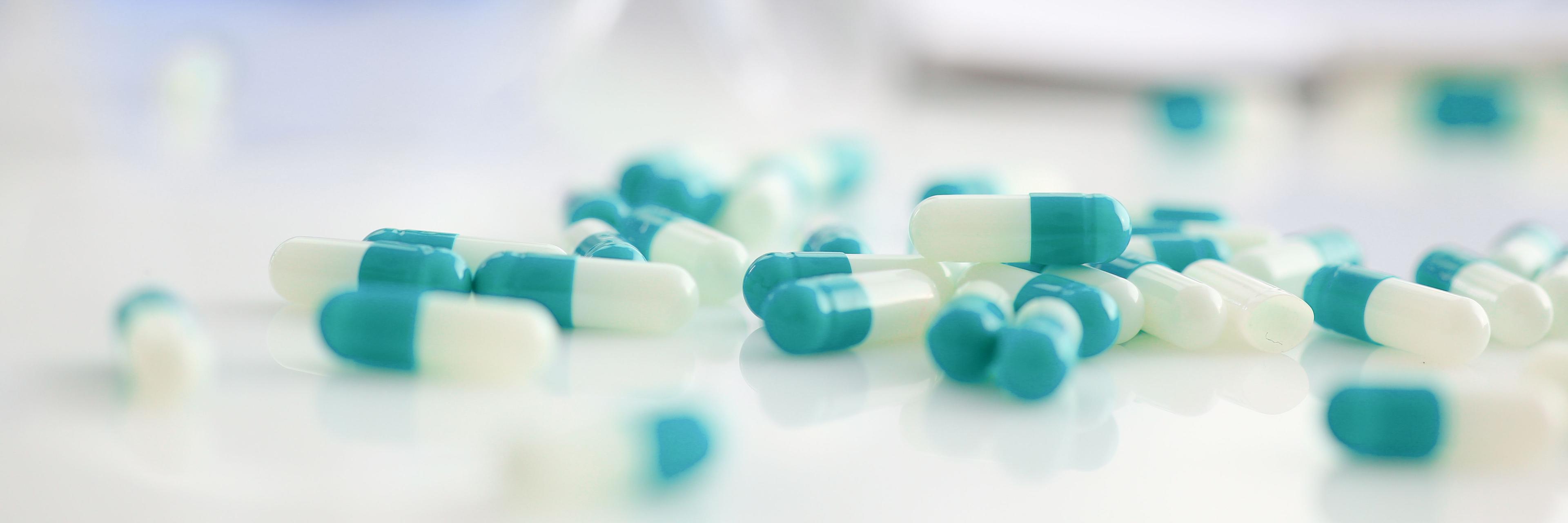 Tablets scattered on the table of the pharmaceutical | Image Credit: © H_Ko - stock.adobe.com